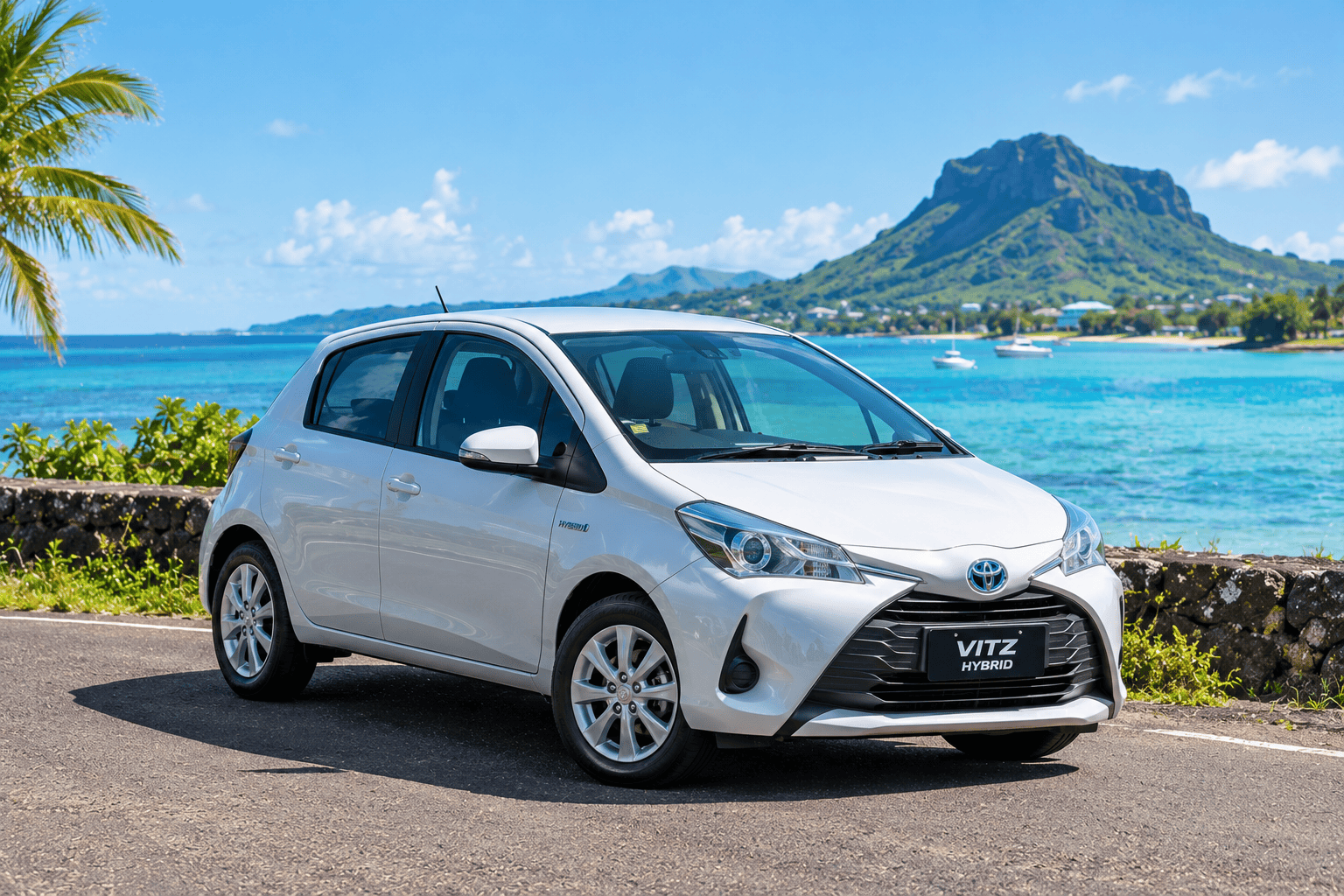 Toyota Vitz Hybrid rental car parked beside the coast in Mauritius
